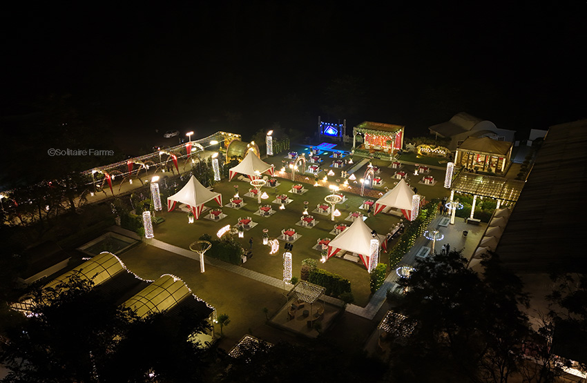 An aerial evening view of the outdoor lawn at The Solitaire Farms